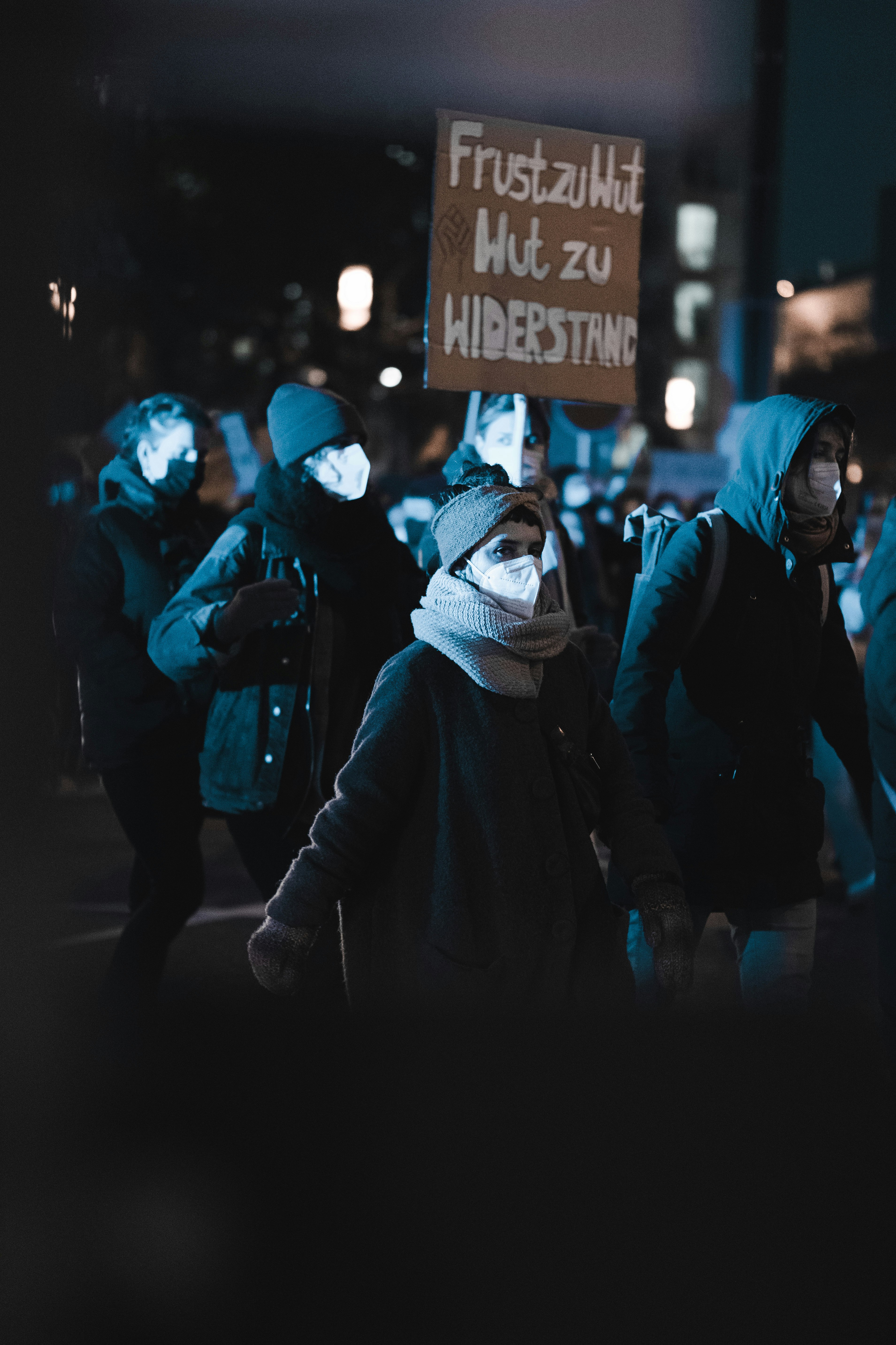 people walking on street during night time